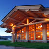 Floor to ceiling windows in log lodge